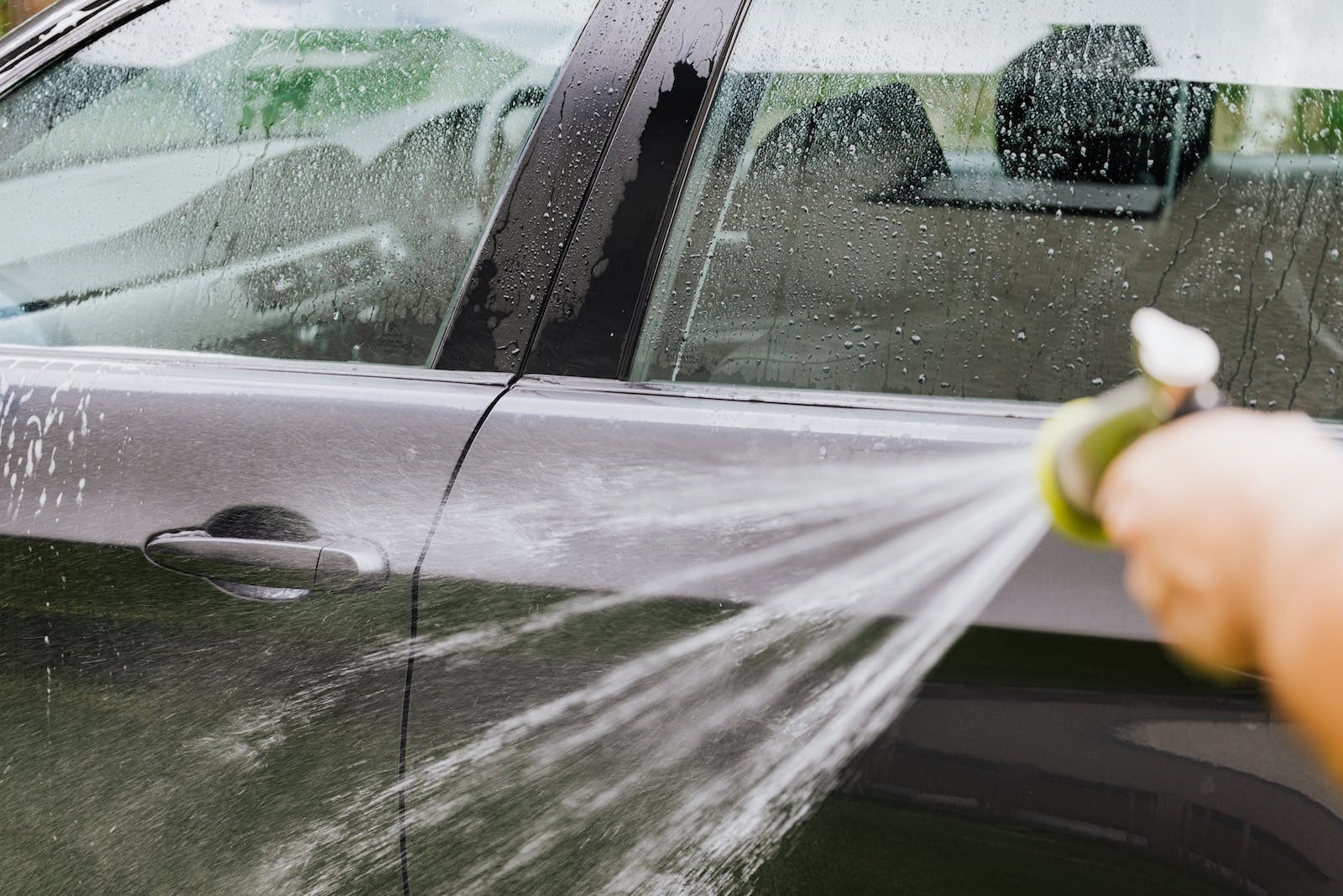 car washing with hose